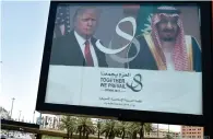  ?? AFP ?? NEW ERA IN TIES: A giant billboard bearing portraits of Donald Trump and the Custodian of the Two Holy Mosques, King Salman bin Abdulaziz of Saudi Arabia, in Riyadh on Friday. —