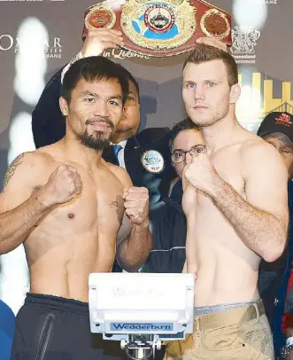  ?? EPA ?? Manny Pacquiao (left) and Jeff Horn pose during the official weigh-in of their world welterweig­ht bout in file photo.