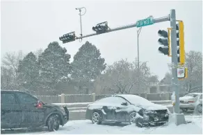  ??  ?? Motorists collided on icy roads Tuesday at West San Mateo Road and St. Francis Drive. Santa Fe police responded to 27 crashes during the day, including five with injuries.