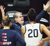  ?? David Butler II / USA TODAY ?? UConn coach Geno Auriemma talks to his team during a break in the second half against Marquette on Monday at Harry A. Gampel Pavilion. UConn won 63-53. Auriemma feels that this postseason will be a test of mental and physical toughness due to COVID-19.