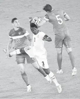  ?? Javier Soriano / Afp/getty Images ?? U.S. defenders Geoff Cameron, left, and Matt Besler take on Ghana’s Asamoah Gyan, but they’ll have to worry about Portugal’s Cristiano Ronaldo on Sunday.