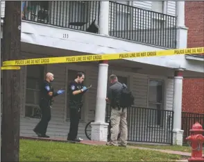  ?? The Sentinel-Record/Grace Brown ?? CRIME SCENE: Garland County Deputy Coroner Jason Neighbors, right, arrives at the scene of a reported fatal shooting at 133 Chapel St. that occurred shortly before 6 p.m. Monday.