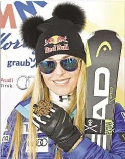  ?? GETTY ?? Lindsey Vonn poses with bronze medal after women's downhill.