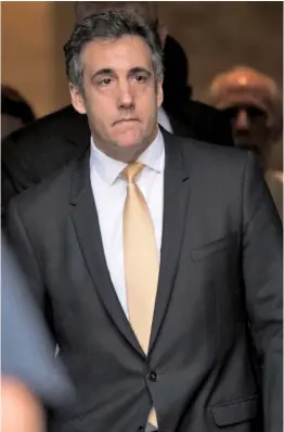  ?? AP PHOTO ?? ON THE FLIP SIDE: Michael Cohen, the former personal attorney for President Trump, leaves federal court in New York yesterday after pleaded guilty to charges including campaign finance fraud.