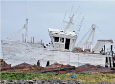  ??  ?? A wooden boat built for Bonfire Night in Skinningro­ve, on the coast of North Yorkshire