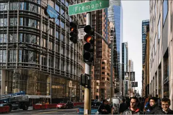  ??  ?? Salesforce Tower (left) stands on Mission Street in downtown San Francisco’s Financial District last month. At 1,070 feet, Salesforce Tower is now the tallest office building west of the Mississipp­i, signaling tech’s triumph in the city. Salesforce...