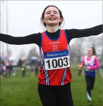  ??  ?? Abaigh Moonan of Dundalk St Gerard’s AC celebrates winning the U-12 girls 4x500m relay during the Irish Life Health National Intermedia­te, Master, Juvenile B and Relays Cross Country at Dundalk IT.