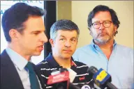  ?? Ned Gerard / Hearst Connecticu­t Media ?? Ian Hockley, center, father of Sandy Hook Elementary School student Dylan Hockley, and Bill Sherlach, right, husband of Sandy Hook school psychologi­st Mary Sherlach, look on as attorney Josh Koskoff speaks a press conference in Bridgeport in March 2019.