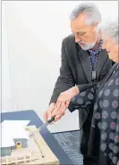  ?? LVN050917j­bhinemoa1 ?? Helen Stevenson and Mayor Michael Feyen cut the cake, which was a replica of the new hall.