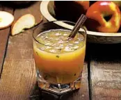  ?? E. JASON WAMBSGANS/CHICAGO TRIBUNE; JOAN MORAVEK/STYLING ?? The iced version of the bourbon-and-cider Thanksgivi­ng kickoff requires freezing the cider into a slushy consistenc­y, a refreshing way to start off the holiday dinner.