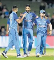  ?? ANI ?? Mohammed Siraj (C) took four wickets in Napier on Tuesday.