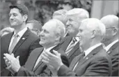  ?? Evan Vucci ?? TRUMP CELEBRATES with Republican leaders on May 4 after the House passed the health bill.