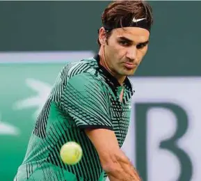  ?? AFP PIC ?? Roger Federer in action against Steve Johnson in Indian Wells on Tuesday.