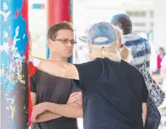  ?? Pictures: MARK STEWART ?? JAIL TIME: Blonde Yvette Nikolic (second left) stands out as she follows other inmates at Lautoka Prison; and (above) jockey Danny Nikolic talks to his parents John and Karen outside the hospital where his brother is in intensive care.