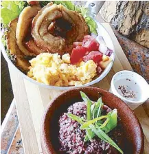  ??  ?? Homemade Bacon Cebu Lechon Belly in lemongrass and cacao spices served with mountain rice, Pinoy salad and scrambled eggs