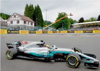  ?? AFP ?? Mercedes’ Lewis Hamilton drives during the second practice session at the Spa-Francorcha­mps circuit in Spa on Friday. —