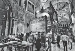 ??  ?? River Countess passengers view the dazzling gem-covered altarpiece at St. Mark's Basilica in Venice during a private, after-hours visit.