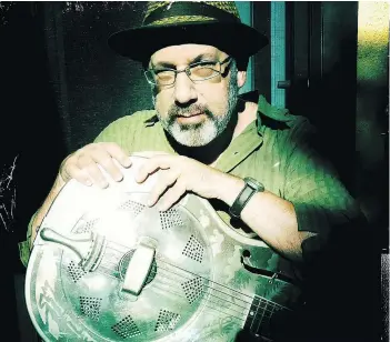  ??  ?? Ken Eisner, with his dobro, conceived and put together Boulevard of Broken Dreams: Old Songs for a New Depression by the Flypaper Orchestra.
