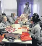  ??  ?? Wrapping paper Fernhill School pupils wrapped presents before sending them off to St Dominic’s Parish in Craigend