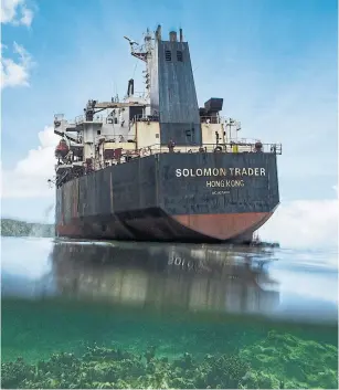  ?? DAVID MAURICE SMITH PHOTOS THE NEW YORK TIMES ?? The Solomon Trader has been leaking oil and poisoning the area’s fishing grounds since February, when it ran aground in violent weather on Rennell Island in the Solomon Islands.