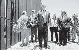  ?? SAUL LOEB/GETTY-AFP ?? President Donald Trump speaks at a ceremony Tuesday commemorat­ing the 200th mile of border wall at the internatio­nal border with Mexico in San Luis, Arizona.