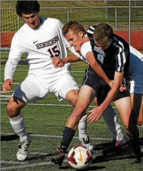  ?? BOB RAINES--DIGITAL FIRST MEDIA ?? North Penn’a Mike Kohler fights for a loose ball with Henderson’s Richie Schlentz and Zach Roberts in the first half Saturday.