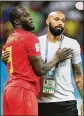  ?? CATHERINE IVILL / GETTY IMAGES ?? Romelu Lukaku of Belgium embraces assistant coach Thierry Henry in celebratio­n after a match.