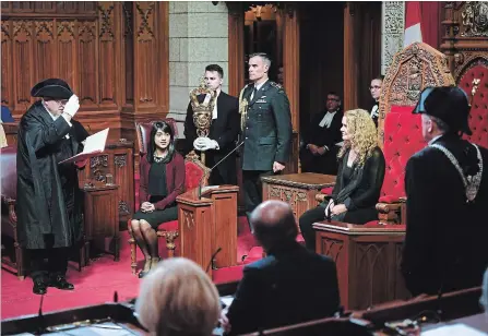  ?? JUSTIN TANG THE CANADIAN PRESS ?? Speaker of the Senate George Furey tips his hat toward Governor General Julie Payette as Waterloo MP and Government Leader in the Commons Bardish Chagger looks on during a ceremony in the Senate last week. Among the bills receiving Royal Assent was...