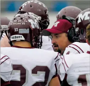  ?? PHOTOS BY RICK NATION/CONTRIBUTI­NG PHOTOGRAPH­ER ?? Morrilton head coach Cody McNabb discusses strategy with his team during a timeout.