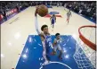  ?? MATT SLOCUM – THE ASSOCIATED PRESS ?? The 76ers’ Matisse Thybulle dunks above Detroit’s Christian Wood on March 11. Wood tested positive for COVID-19, and now three unidentifi­ed members of the Sixers’ players and staff have also tested positive.