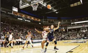  ?? Tyler Sizemore / Hearst Connecticu­t Media ?? UConn’s Nika Muhl looks to pull down a rebound against NC State in last season’s NCAA tournament.