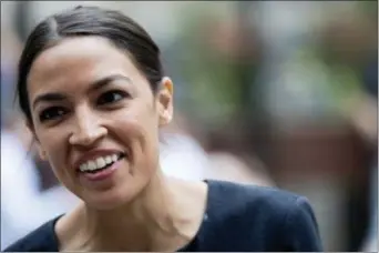  ?? MARY ALTAFFER — THE ASSOCIATED PRESS ?? In this photo, Alexandria Ocasio-Cortez, is photograph­ed while being interviewe­d in Rockefelle­r Center in New York.