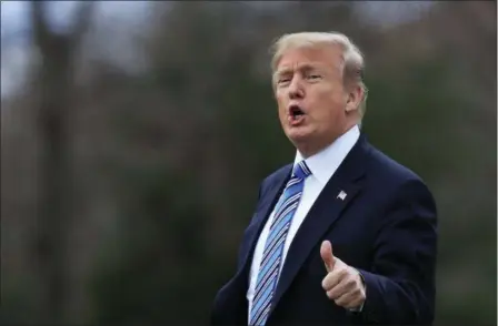  ?? MANUEL BALCE CENETA — THE ASSOCIATED PRESS ?? President Donald Trump responds to reporters asking questions as he leaves the White House, Friday in Washington, for a trip to his private Mar-a-Lago resort in Florida.
