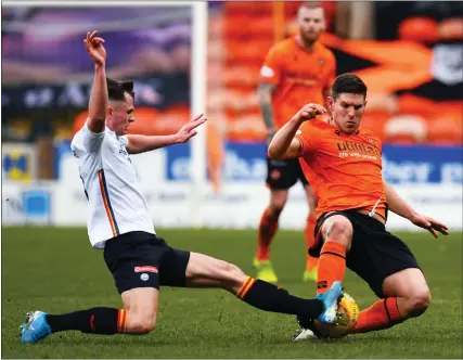  ??  ?? Dillon Powers, right, in action for Dundee United during his side's 1-1 draw with Partick Thistle