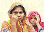  ?? SANJEEV VERMA/HT ?? Ashok Kumar’s wife Mamta (in orange) at her home on Wednesday. Kumar, 42, was arrested by the Gurgaon police for killing
Pradyumn Thakur on September 8.