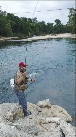  ??  ?? Tonkinson (above) tries for smallmouth bass on Little Sugar Creek near Jane, Mo. An Ozark bass (below) caught early in the trip sparked optimism for a good day of wade fishing.