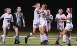  ?? AUSTIN HERTZOG - MEDIANEWS GROUP ?? Camilla Kuever, center left, and Samantha Goffice hug after connecting for Boyertown’s fourth goal against Methacton.