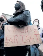  ?? GETTY IMAGES ?? A protester in Minneapoli­s, Minn., holds a sign that reads the name of Daunte Wright, a Black man killed by police during a traffic stop.