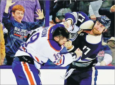  ?? KIRK IRWIN / GETTY IMAGES / AFP ?? Brandon Dubinsky of the Columbus Blue Jackets trades punches with Patrick Maroon of the Edmonton Oilers during the second period of their NHL game at Nationwide Arena in Columbus, Ohio, on Tuesday. The Blue Jackets won 3-1.