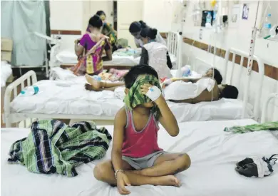  ??  ?? Children receive treatment at a hospital in Vishakhapa­tnam, India, on Friday after they were affected by Thursday’s gas leak from the LG Polymers factory.
