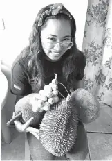  ??  ?? Like any Mindanaoan, the ace athlete loves durian and marang, two of the island’s exotic fruits.