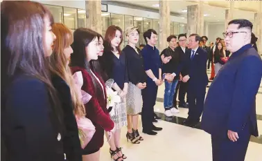  ?? AFPPIX/KCNA VIA KNS ?? Kim speaks to South Korean musicians after the concert at the East Pyongyang Grand Theatre on Sunday.