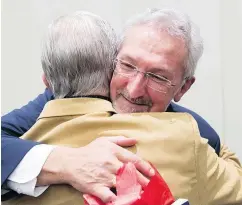  ?? — CP PHOTO ?? Leonard Krog is congratula­ted after he was elected mayor of Nanaimo Saturday. Krog will now have to step down as NDP MLA, forcing a byelection.