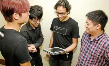  ??  ?? From left, alfred Tay, Luso yong, Shaikh Zhafri and Jeremy Choo from undercover entertainm­ent hold regular meetings to fine tune agentrX’s features.