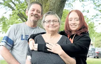  ?? CHERYL CLOCK/THE STANDARD ?? Karen Cutler, 52, of Welland is living with cancer and began palliative care earlier this year. Palliative care does not mean there is no hope. Indeed, it helps people live the fullest, the best they can with a life-limiting illness. She is pictured with husband Kevin, 54 and 14-year-old daughter, Kristy, who just graduated Grade 8.