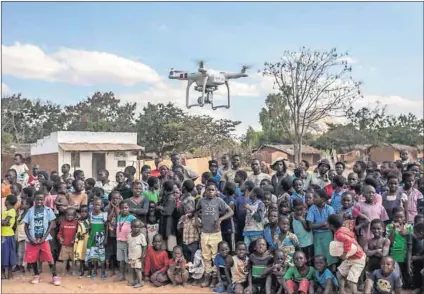  ??  ?? High tech: Unicef tests a drone ahead of opening a corridor that will enable these devices to transport blood samples to and from the hard-to-reach rural Chanthunth­u health clinic in Kasungu. Photo: Amos Gumulira/AFP