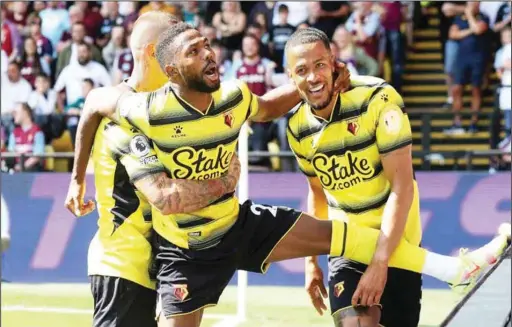  ??  ?? Emmanuel Dennis (centre) celebratin­g his English Premier League debut goal with compatriot William Troost-Ekong as Watford defeated Aston Villa 3-2 in the opening weekend of the 2021/22 season