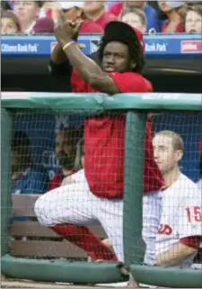  ?? CHRIS SZAGOLA — THE ASSOCIATED PRESS ?? Phillies’ outfielder Odubel Herrera, who wasn’t in the starting lineup courtesy of manager Pete Mackanin, cheers his team on from the dugout during the first inning of Wednesday’s game against the Houston Astros.