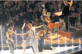  ?? Genaro Molina Los Angeles Times ?? DANCERS from the Tero Saarinen Company accompany the L.A. Phil on Friday.