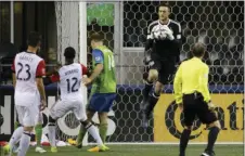  ??  ?? In this July 19 file photo, Seattle Sounders goalkeeper Tyler Miller (second from right), leaps to grab the ball against D.C. United in the second half of an MLS soccer match, in Seattle. AP PHOTO/TED S. WARREN